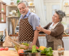 Elderly couple cooking